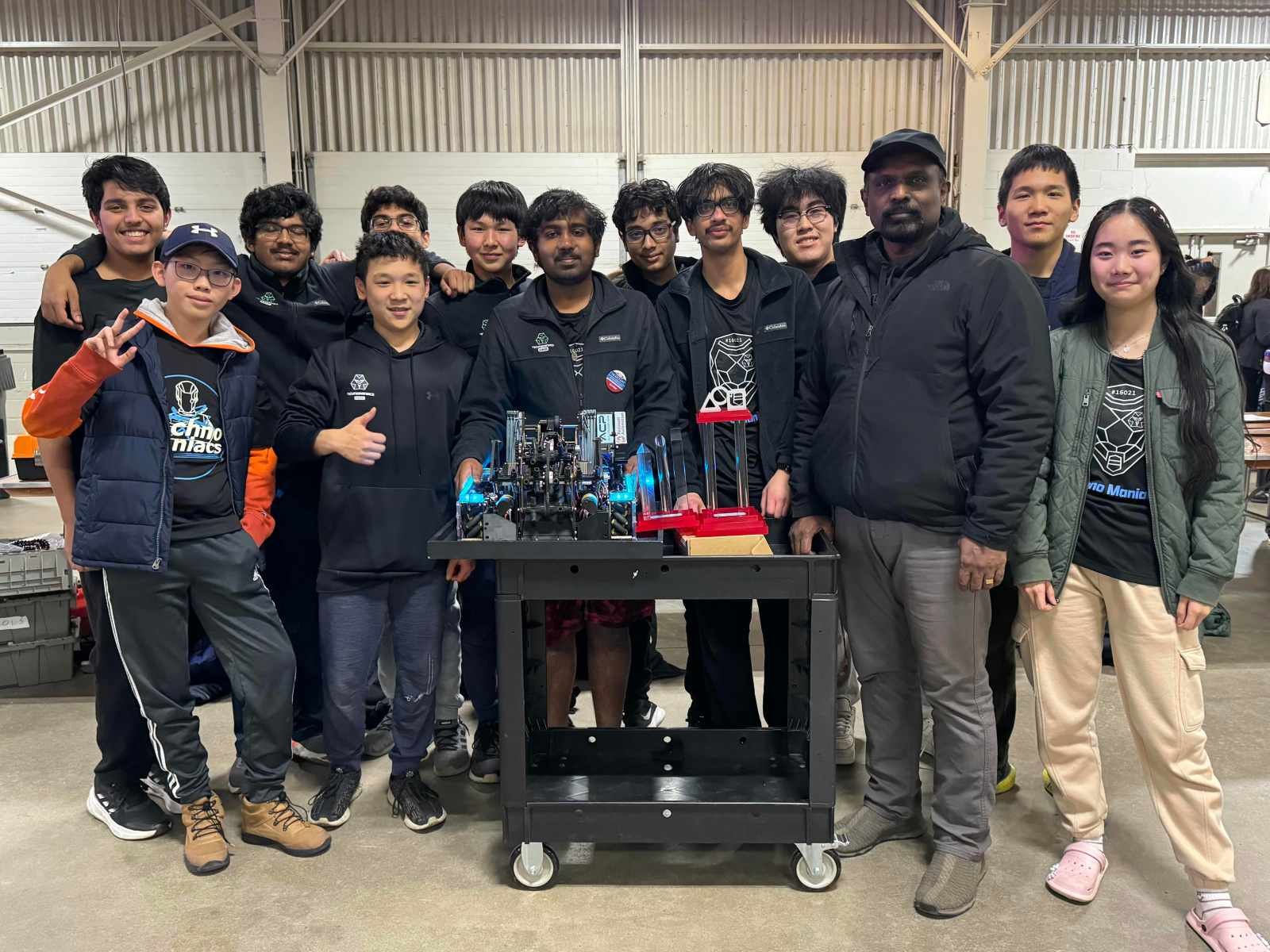 FTC Team 16021 Techno Maniacs with their competition robot and trophy